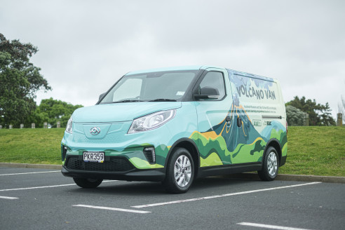 Picture of van painted with a volcano on the side. 