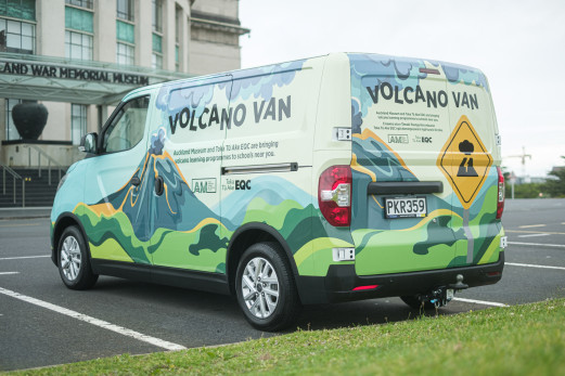 Photo of colourful van in a parking spot with a volcano painted on the side