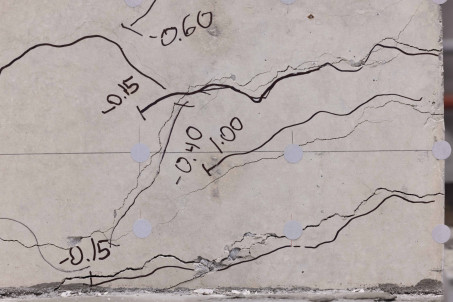 Measurements shown on cracks in concrete wall, after being earthquake tested in the Seismic Engineering Laboratory 