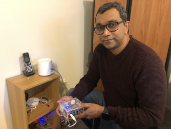 Dr Raj Prasanna installs one of the low-cost seismic sensor.