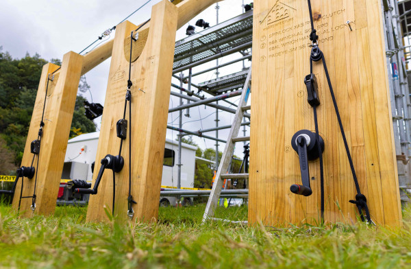 Close-up of the grinders used to create tension on the timber structure.